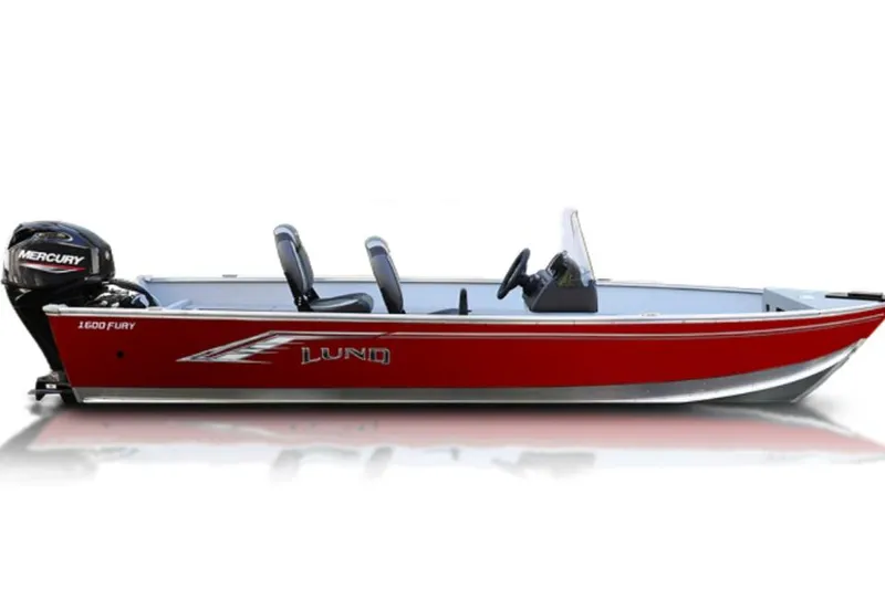 Slide: The Image of 2026 Lund 1600 Fury SS boat with Mercury 40 outboard motor, parked outdoors. - 1