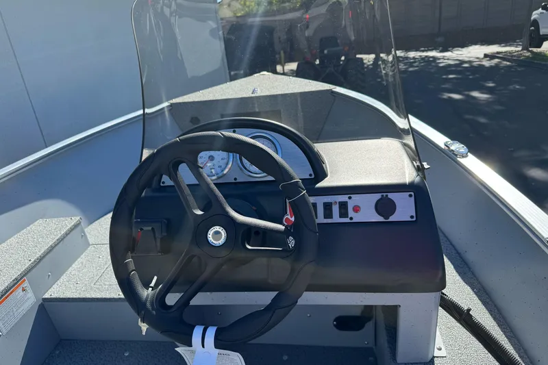 Slide: The Image of Steering console of 2026 Lund 1600 Fury SS boat with gauges and controls. - 5