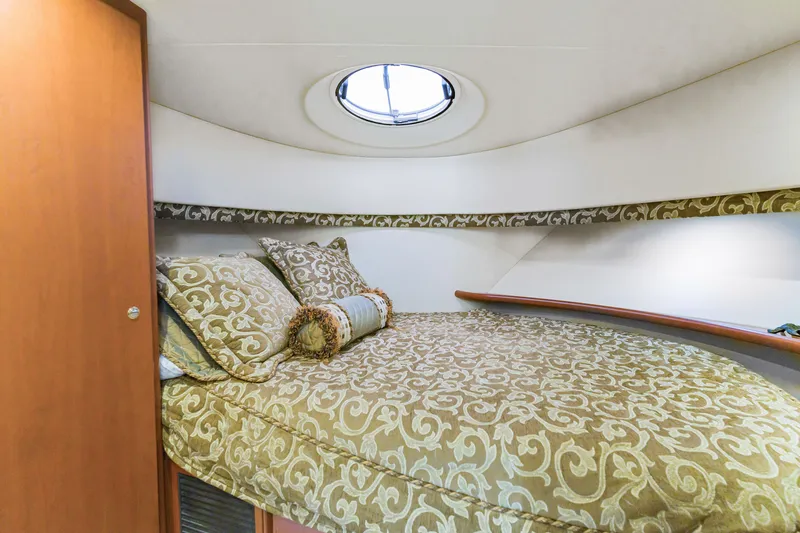 Slide: The Image of Luxurious cabin interior of 2005 Silverton 34 Convertible yacht with elegant bedding. - 10