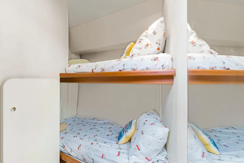 Slide: The Image of Bunk beds in 2005 Silverton 34 Convertible yacht cabin with playful bedding. - 11
