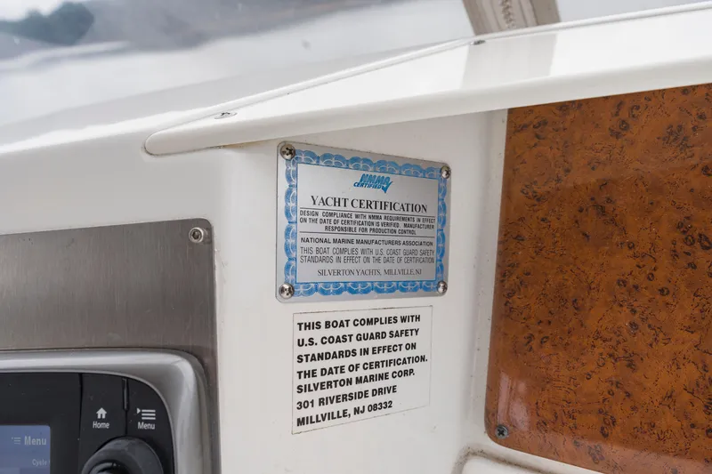 Slide: The Image of 2005 Silverton 34 Convertible yacht certification and safety compliance plaques. - 19