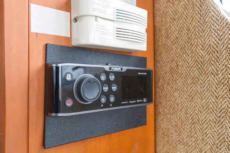 Slide: The Image of Fusion stereo system and smoke detector on 2005 Silverton 34 Convertible yacht interior. - 24