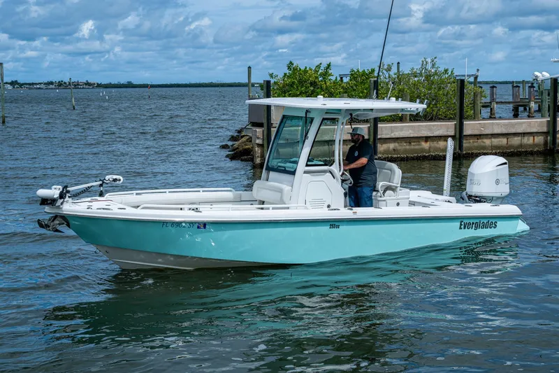 The Image of 2021 Everglades 253 Center Console boat on water, featuring sleek design and modern amenities. - 0