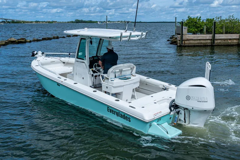Slide: The Image of 2021 Everglades 253 Center Console boat on water, featuring Yamaha engine. - 11