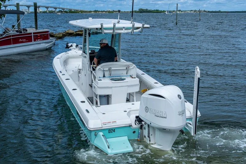 Slide: The Image of 2021 Everglades 253 Center Console boat with Yamaha engine on the water. - 12