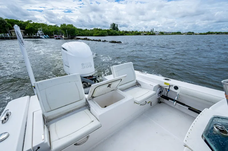Slide: The Image of 2021 Everglades 253 Center Console boat with Yamaha 300 engine on open water. - 24