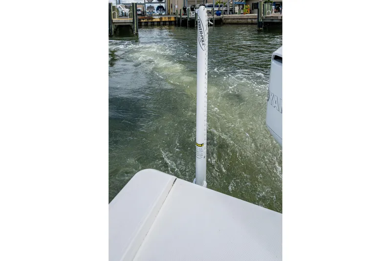 Slide: The Image of 2021 Everglades 253 Center Console boat at dock, featuring Power-Pole anchor system. - 27