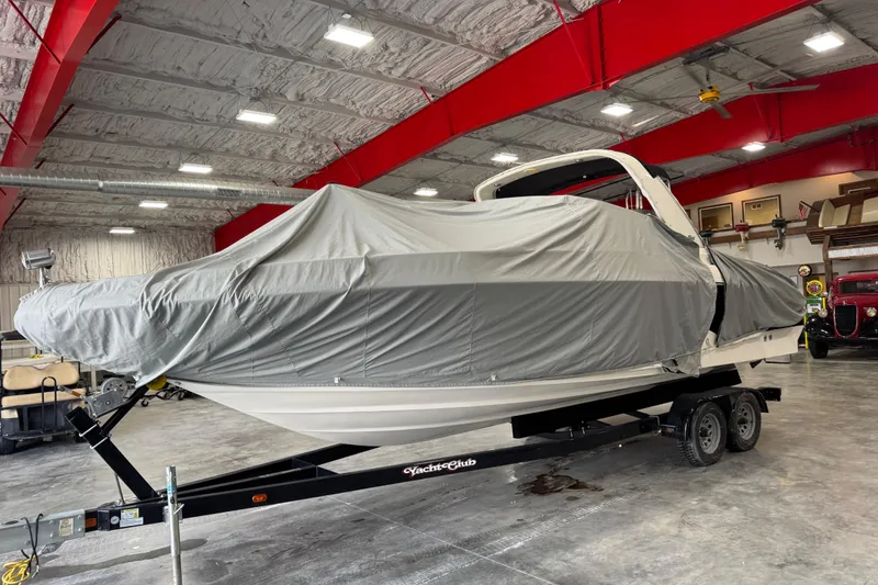 Slide: The Image of Covered 2001 Sea Ray 280 Bow Rider on trailer in indoor storage facility. - 10