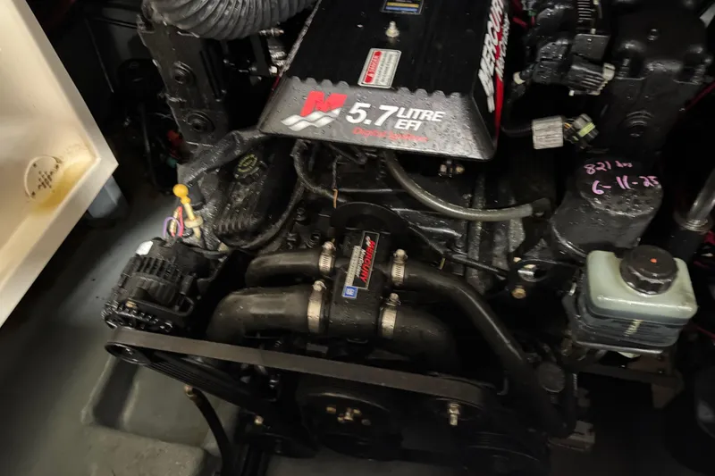 Slide: The Image of Engine of a 2001 Sea Ray 280 Bow Rider, featuring a 5.7L EFI MerCruiser. - 11