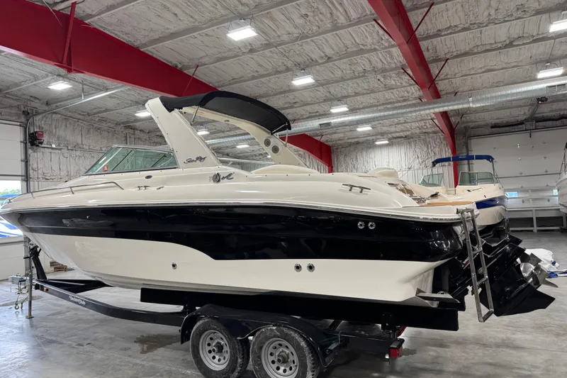 Slide: The Image of 2001 Sea Ray 280 Bow Rider boat on trailer in indoor storage facility. - 3