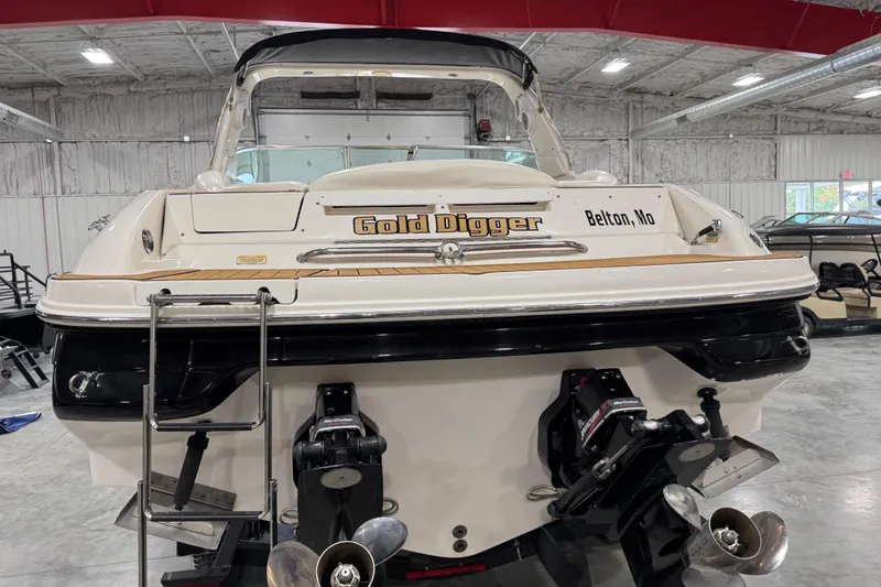Slide: The Image of 2001 Sea Ray 280 Bow Rider boat named "Gold Digger" in a storage facility. - 5
