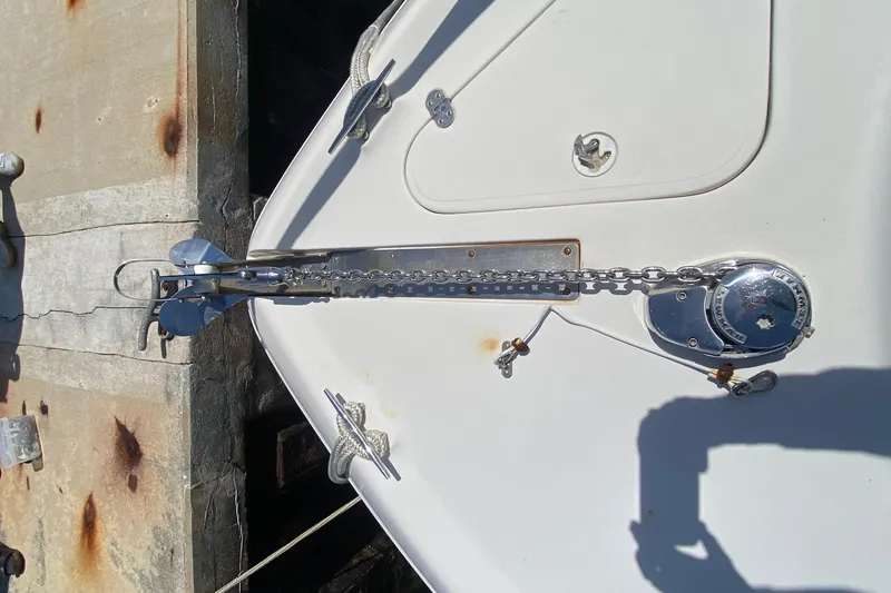 Slide: The Image of Bow of a 2005 Monterey 302 Cruiser with anchor chain and winch. - 14