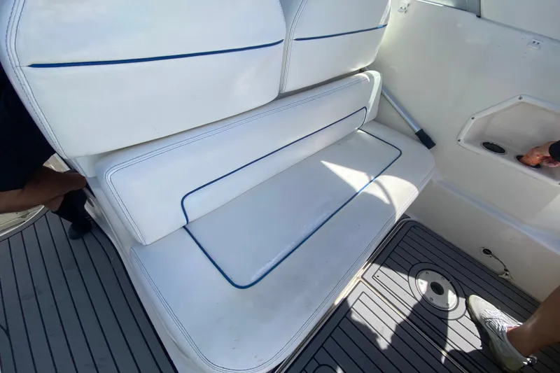 Slide: The Image of White seating area on a 2005 Monterey 302 Cruiser boat deck. - 18
