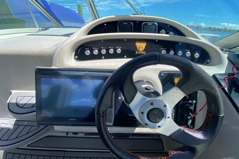Slide: The Image of Steering console of a 2005 Monterey 302 Cruiser with navigation display and controls. - 20