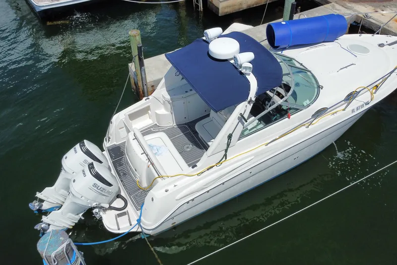 Slide: The Image of 2005 Monterey 302 Cruiser docked with dual Suzuki outboard engines. - 31