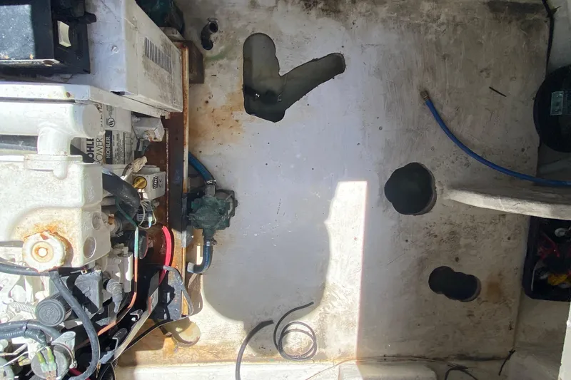 Slide: The Image of Engine compartment of a 2005 Monterey 302 Cruiser boat, showing mechanical components. - 35