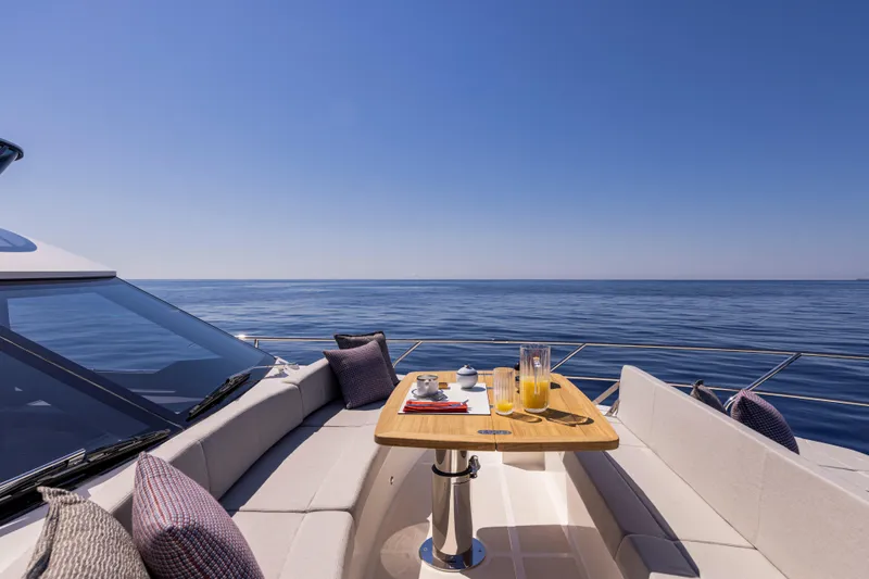 Slide: The Image of Luxurious interior of 2025 Absolute 56 FLY yacht with modern kitchen and ocean view. - 14