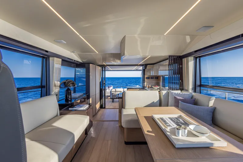 Slide: The Image of Luxurious interior of 2025 Absolute 56 FLY yacht with ocean view and modern seating. - 17