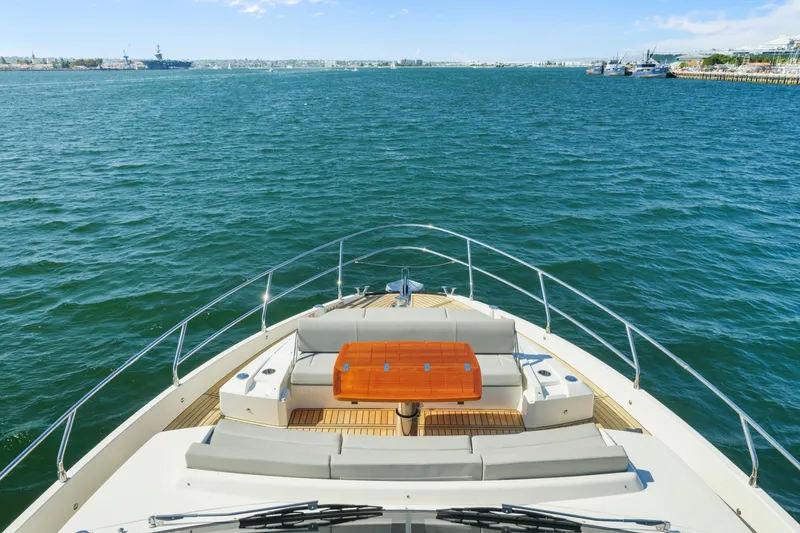 Slide: The Image of Luxurious bedroom interior of 2025 Absolute 56 FLY yacht with modern decor and porthole view. - 21