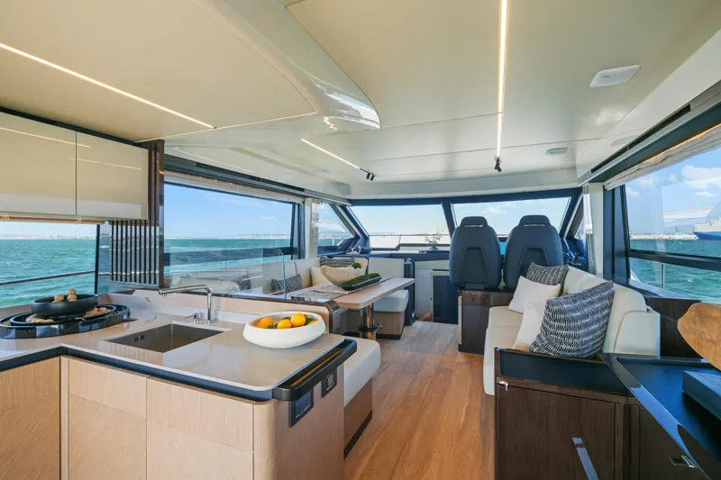 Slide: The Image of Luxurious interior of 2025 Absolute 56 FLY yacht with ocean view and elegant decor. - 27