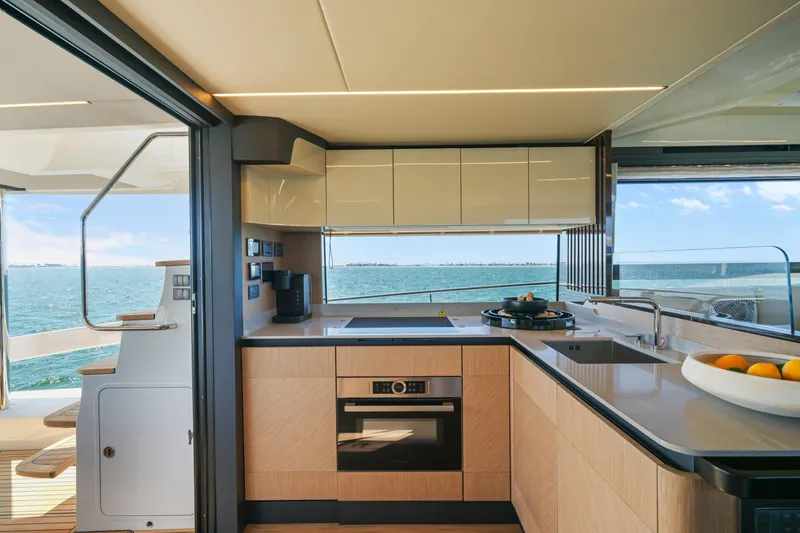 Slide: The Image of Luxurious bedroom interior of 2025 Absolute 56 FLY yacht with modern decor and ample natural light. - 28