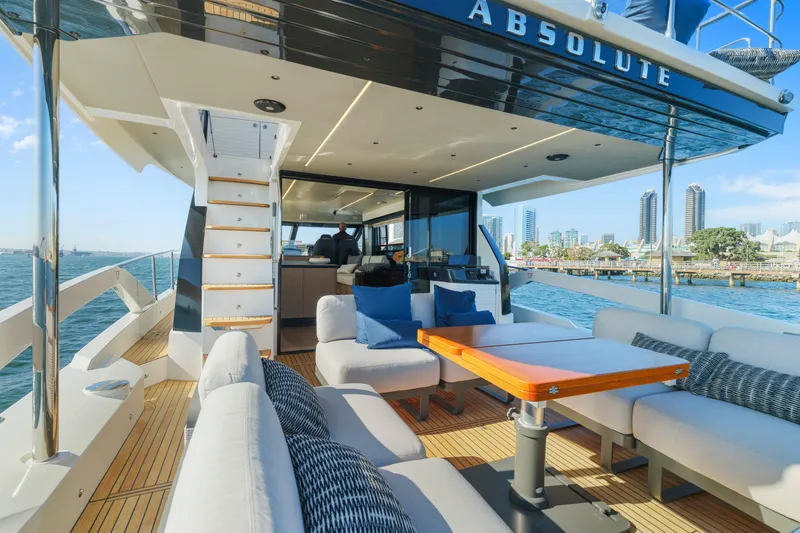 Slide: The Image of Luxurious 2025 Absolute 56 FLY yacht with spacious deck and city skyline view. - 39