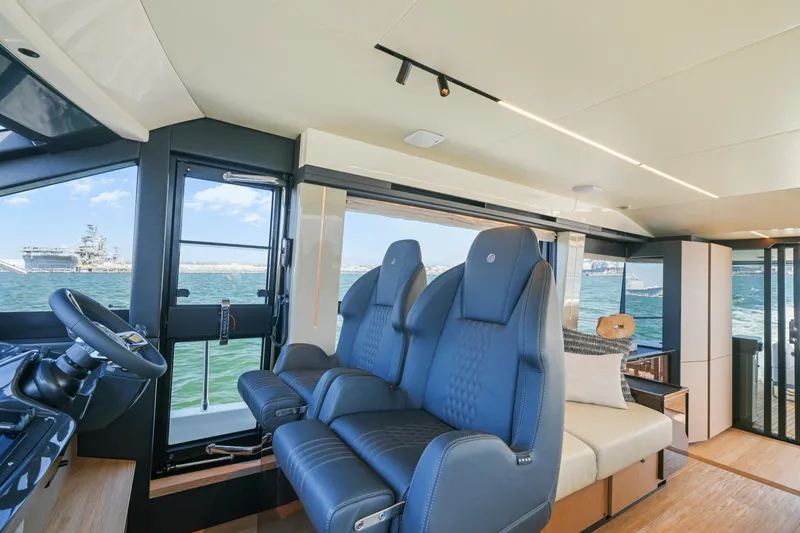 Slide: The Image of Luxury helm of 2025 Absolute 56 FLY yacht with ocean view. - 43