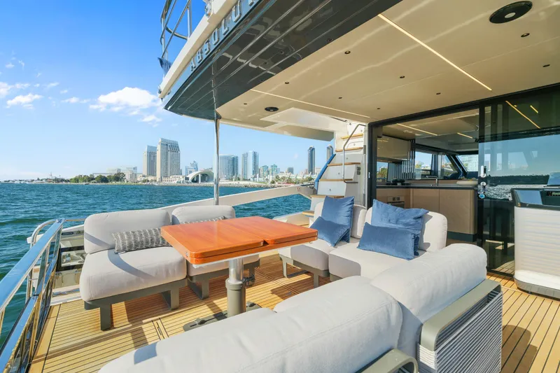 Slide: The Image of Luxurious 2025 Absolute 56 FLY yacht with spacious deck and city skyline view. - 45