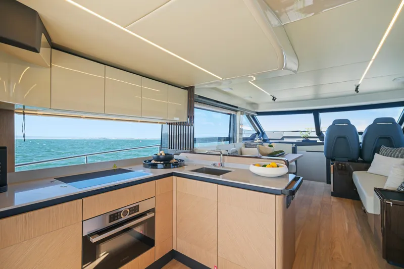 Slide: The Image of Luxurious 2025 Absolute 56 FLY yacht with elegant outdoor seating and city skyline view. - 8