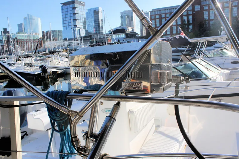 Slide: The Image of Boat docked in marina with Magma grill, city skyline in background, Tartan 38, 1976. - 14