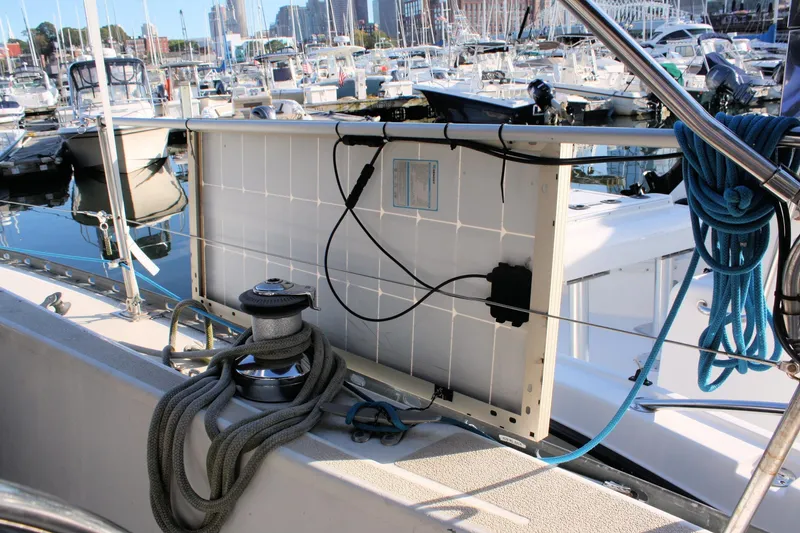 Slide: The Image of 1976 Tartan 38 sailboat with solar panel and marina view. - 15