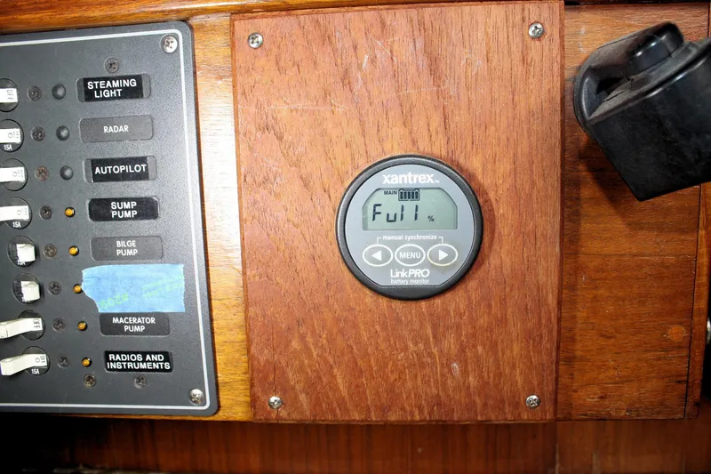 Slide: The Image of Control panel of a 1976 Tartan 38 sailboat with Xantrex battery monitor. - 47