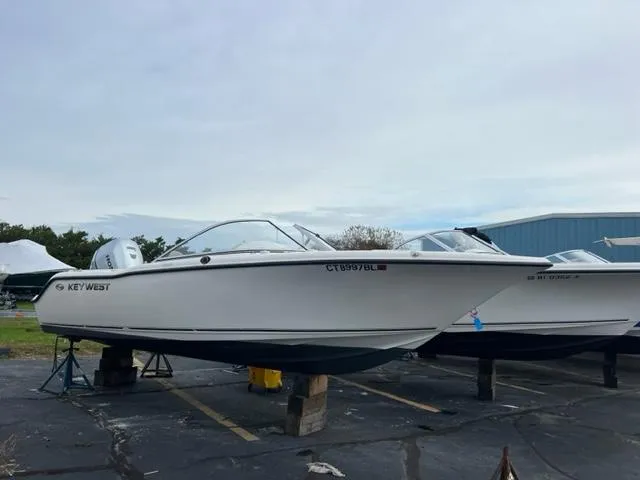 Slide: The Image of 2020 Key West 203 DFS boat on stands in a parking lot. - 0