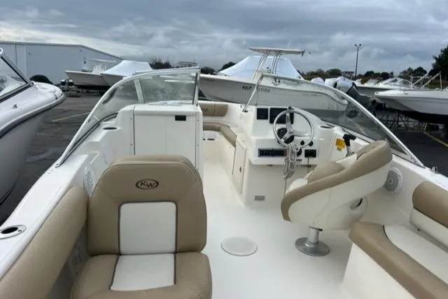 Slide: The Image of 2020 Key West 203 DFS boat interior with beige and white seating. - 8
