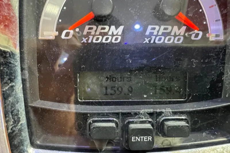 Slide: The Image of Dashboard of 2014 Chaparral 327 SSX showing RPM and engine hours. - 19