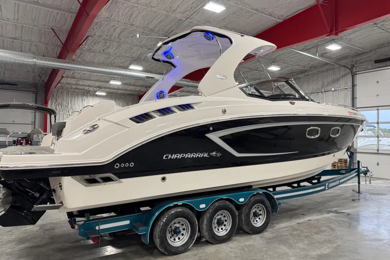 Slide: The Image of 2014 Chaparral 327 SSX boat on trailer in indoor storage facility. - 4