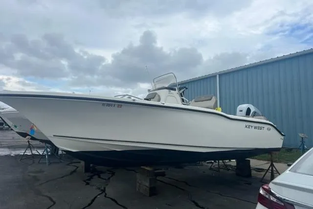 The Image of 2021 Key West 239 FS boat on dry dock, overcast sky background. - 1
