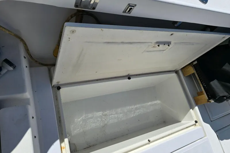 Slide: The Image of Open storage compartment on 1987 Luhrs 30 Alura Classic boat deck. - 11