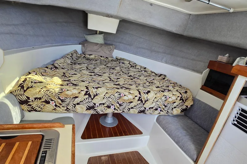 Slide: The Image of Cozy cabin interior of 1987 Luhrs 30 Alura Classic with floral bedspread. - 18
