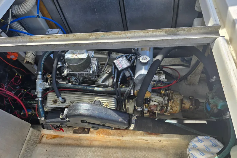 Slide: The Image of Engine compartment of a 1987 Luhrs 30 Alura Classic boat, showcasing mechanical components. - 34