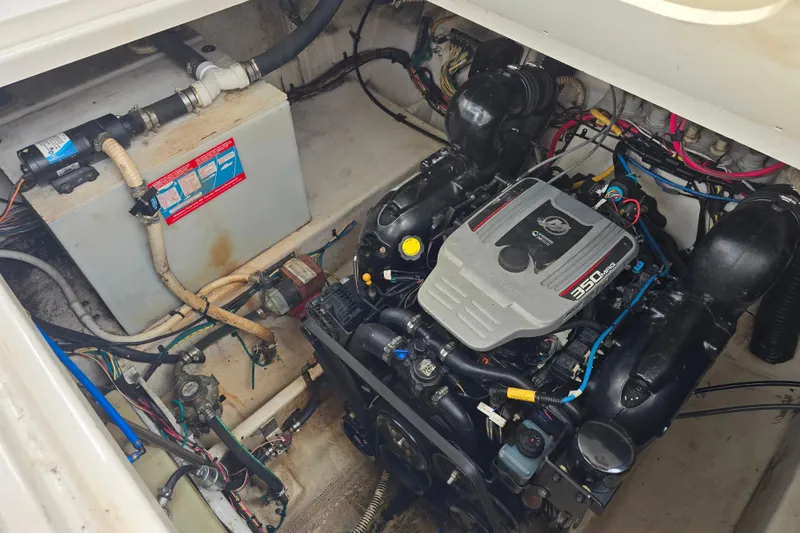 Slide: The Image of Engine compartment of a 2011 Bayliner 285 boat, featuring a 350 MAG engine. - 20