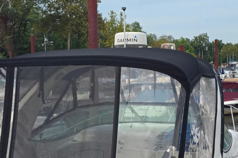 Slide: The Image of 2011 Bayliner 285 boat with Garmin radar, docked in a marina. - 5