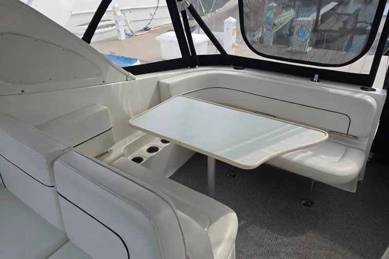 Slide: The Image of Interior of 2011 Bayliner 285 boat with seating and table arrangement. - 6