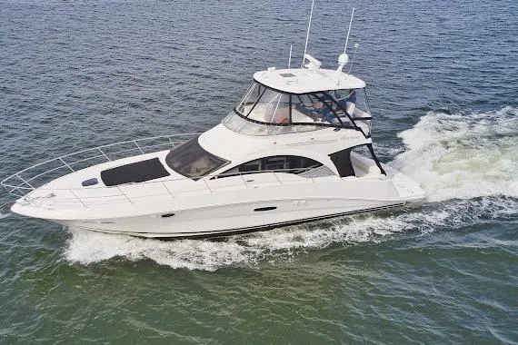 The Image of 2008 Sea Ray 47 Sedan Bridge yacht cruising on open water. - 0