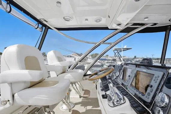 Slide: The Image of 2008 Sea Ray 47 Sedan Bridge helm with modern navigation equipment and luxurious seating. - 15