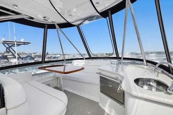 Slide: The Image of Interior of 2008 Sea Ray 47 Sedan Bridge yacht with seating and kitchenette. - 18