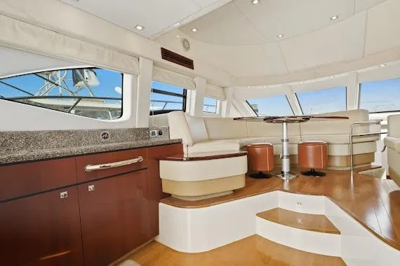 Slide: The Image of Luxurious interior of 2008 Sea Ray 47 Sedan Bridge yacht with elegant seating and modern design. - 27