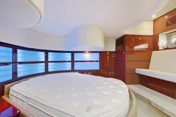 Slide: The Image of Luxurious interior of 2008 Sea Ray 47 Sedan Bridge yacht with round bed and modern design. - 30
