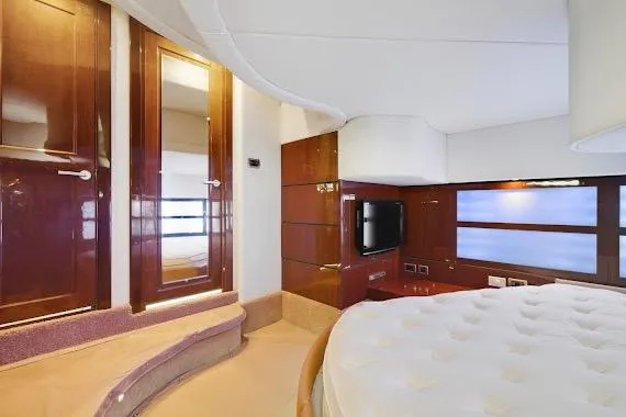 Slide: The Image of Luxurious interior of 2008 Sea Ray 47 Sedan Bridge yacht with elegant wood finishes. - 31