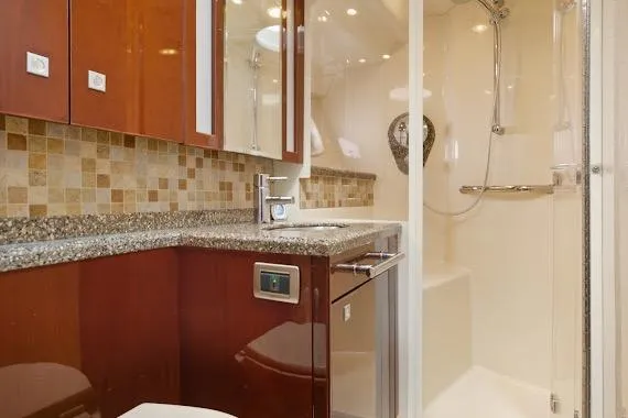 Slide: The Image of Luxurious bathroom in 2008 Sea Ray 47 Sedan Bridge yacht with modern fixtures. - 32